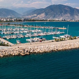 Aerial view of different boats in marina, High angle view of luxury yachts moored on sea harbor. Sailboats docked in a row at port Antalya, Turkey.